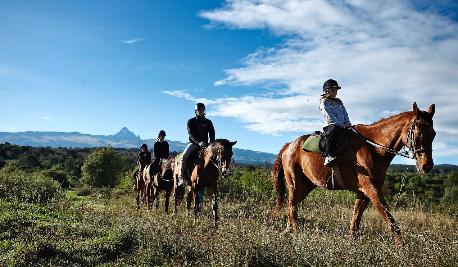 Guests enjoying horseback riding safari while on a kenyan safari.