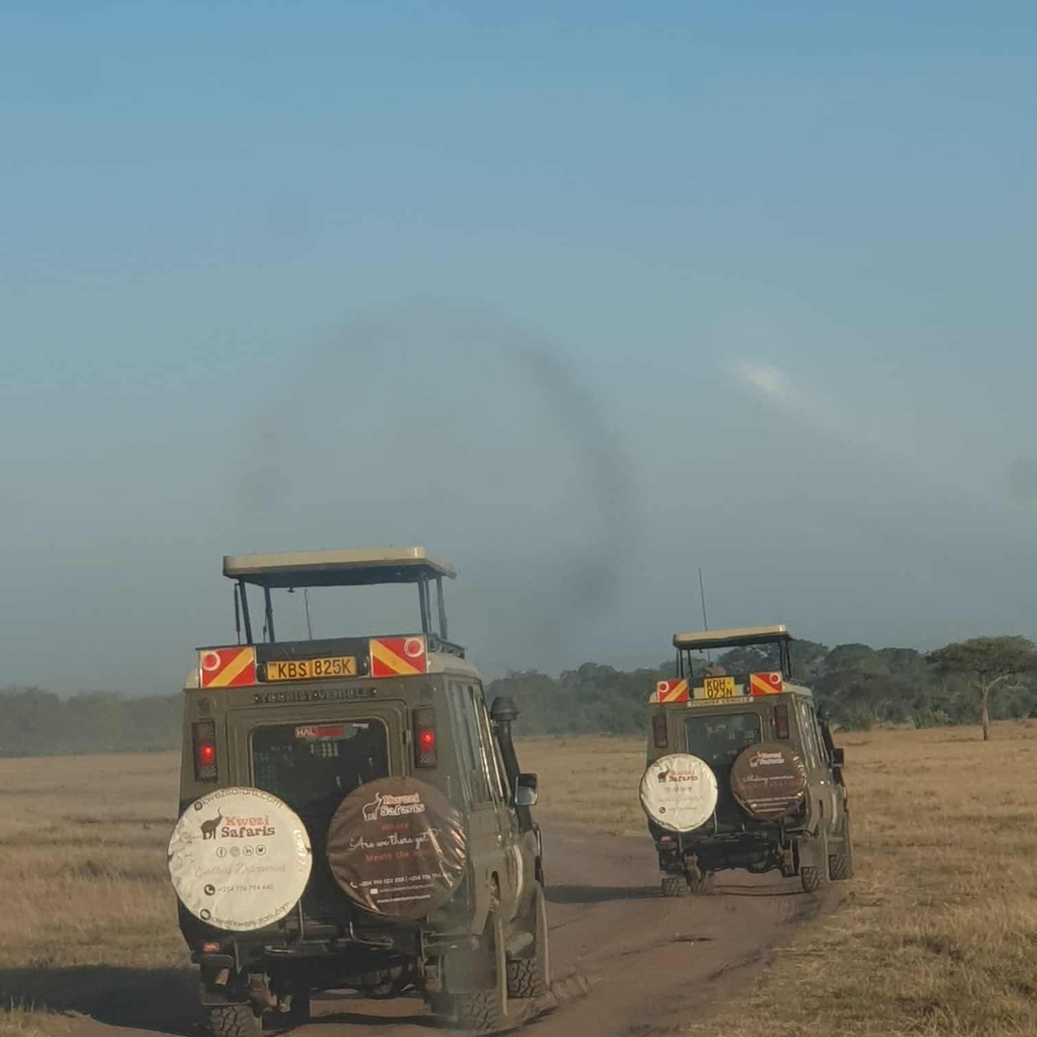 Kwezi Safaris land cruisers on a safari
