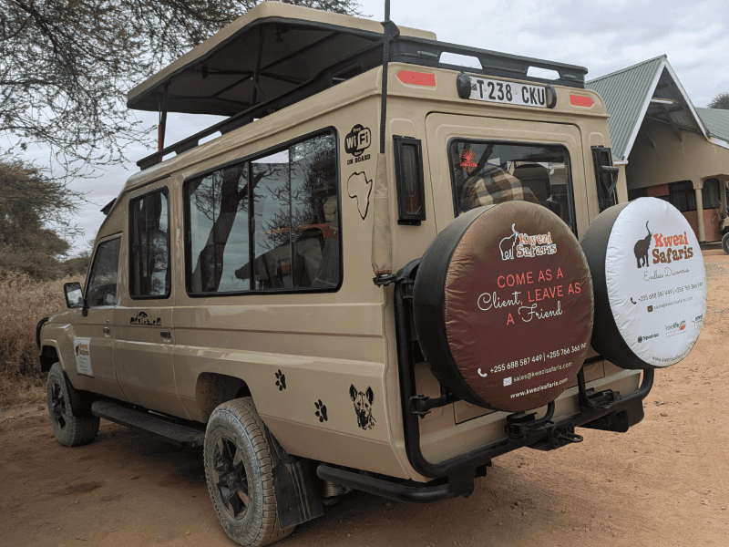 A kwezi Safaris Tour vehicle.